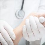 Doctor Wearing Perfect Touch Premium Latex Exam Gloves