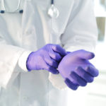 Medical Professional In Trufit Violet Ultra Thin Nitrile Exam Gloves